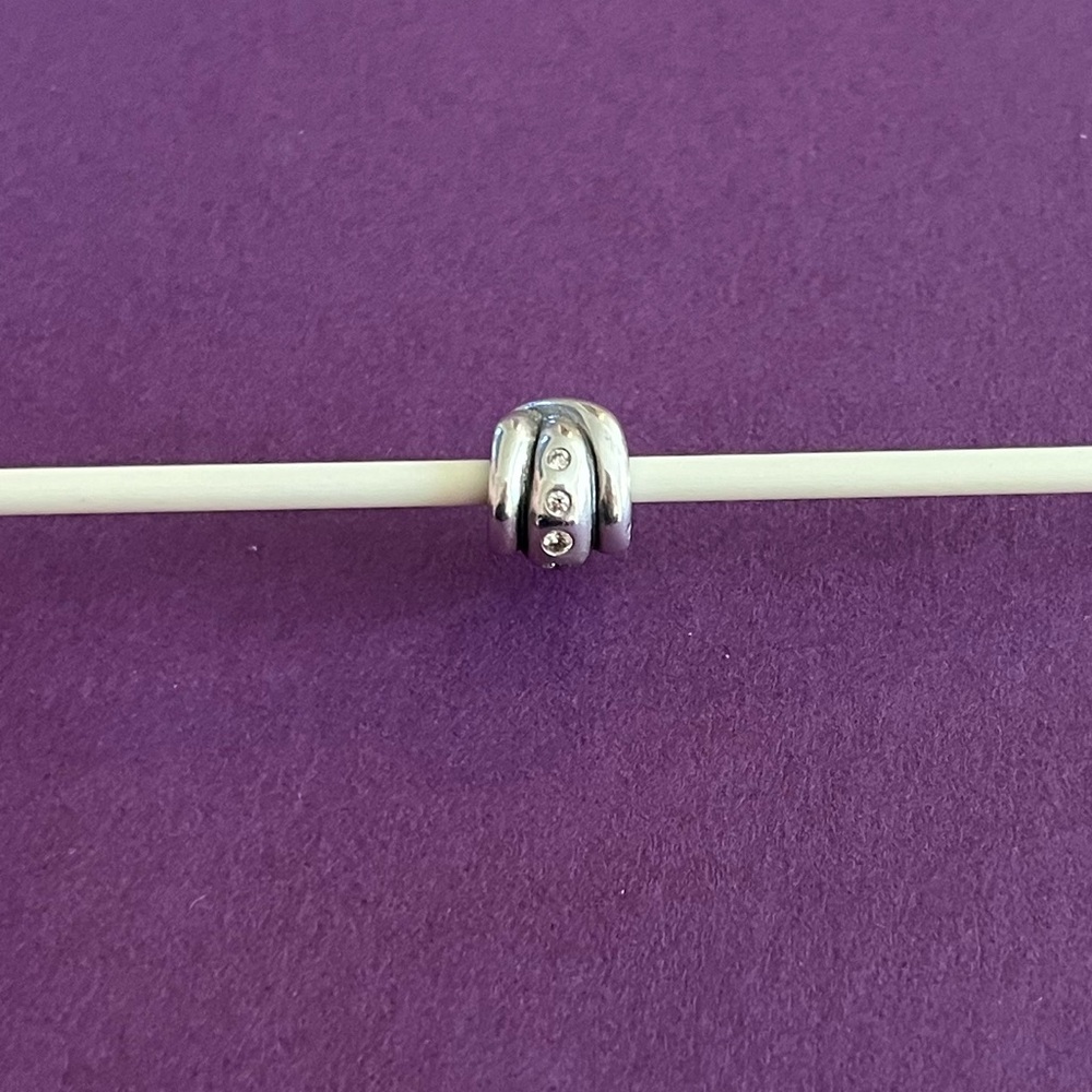 Pandora Retired Champagne Swirl Sterling Silver charm with CZ stones.